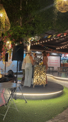 Band performs outdoor evening concert in Thai market area