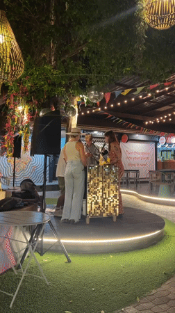 Band performs outdoor evening concert in Thai market area