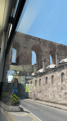 Ancient stone aqueduct filmed from vehicle in Istanbul
