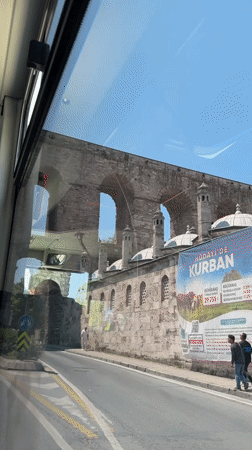 Ancient stone aqueduct filmed from vehicle in Istanbul
