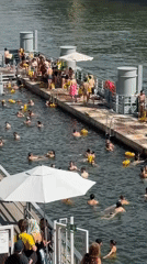Sunny day swimming in a Paris river or canal