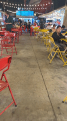 Evening market bustles with diners and fruit vendors in Pattaya