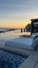 Beachgoers enjoy leisure time at Bali resort during sunset