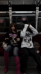 Two women rest on Buenos Aires subway bench