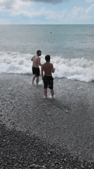 Busy summer afternoon on Batumi's Black Sea pebble beach