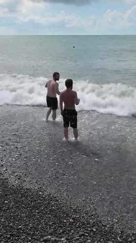 Busy summer afternoon on Batumi's Black Sea pebble beach
