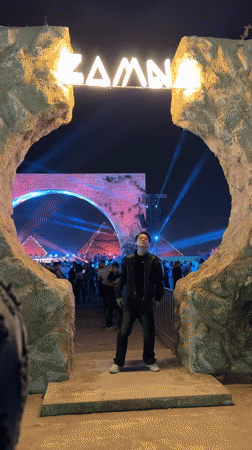 Man enters ZAMNA event through lit archway in Giza