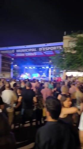 Live band plays outdoor night concert at Ripollet municipal venue