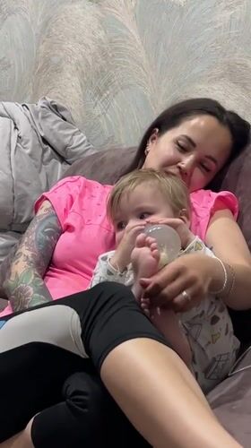 Mother and child share intimate moments at home
