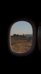 Passenger films runway view from aircraft at Valencia Airport