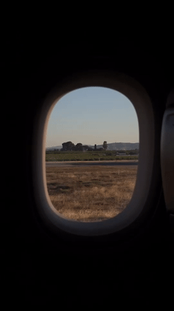 Passenger films runway view from aircraft at Valencia Airport