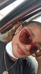 Woman in red sunglasses spotted in vehicle, Juan Griego