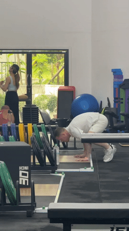 Man performs handstand exercise at Thailand gym