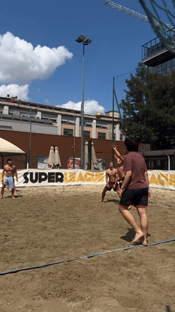 Young adults play volleyball, football in sunny Milan parks