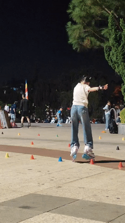 Nighttime skating and dancing activities captured near Da Lat Market