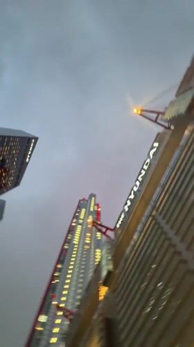 Evening lights illuminate Seoul skyscrapers including Conrad Hotel