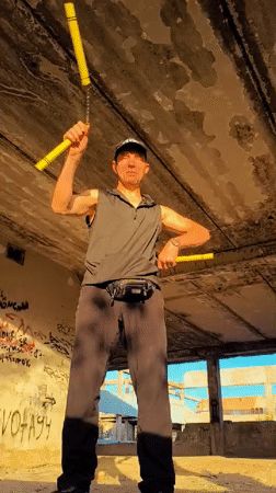 Nunchuck practice in an abandoned Qarağandı building
