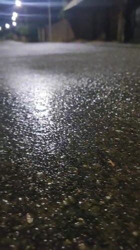 Rainy night in Jos: wet streets, anime quotes, and late-night vibes