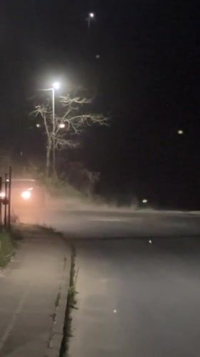 Car drifts at intersection in Zlatograd, Bulgaria creating dust cloud