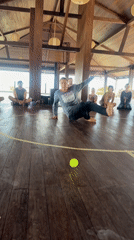 Group gathers in circle for morning activity in Mengwi pavilion