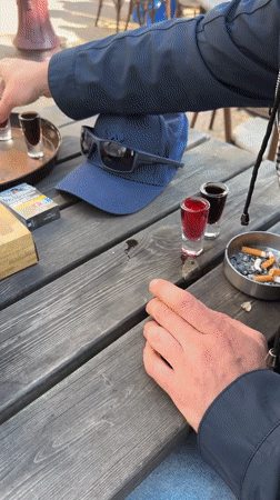 Amsterdam café crowd enjoys afternoon Flügel shots and games