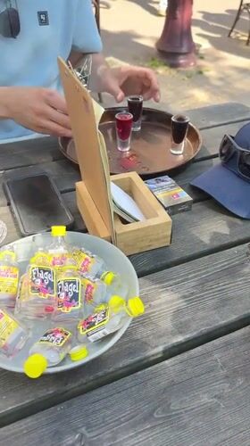 Amsterdam café crowd enjoys afternoon Flügel shots and games