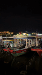 Colorful boats line waterway in Hội An, Vietnam