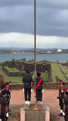 Sunset and a flag ceremony at Galle Fort's ocean ramparts