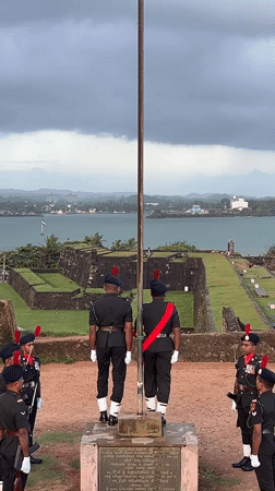 Sunset and a flag ceremony at Galle Fort's ocean ramparts