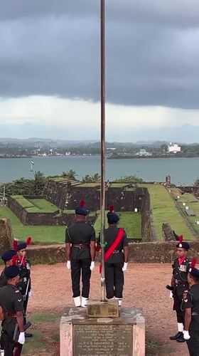 Sunset and a flag ceremony at Galle Fort's ocean ramparts