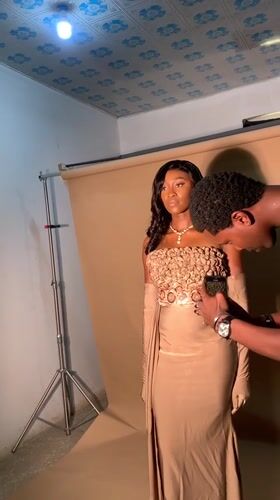 Photography session captures woman in formal dress, Nigeria studio