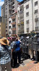 Police with riot shields deployed on Caracas street