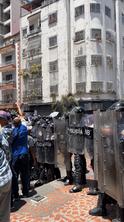 Police with riot shields deployed on Caracas street