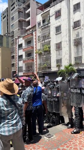 Police with riot shields deployed on Caracas street
