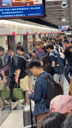 Crowded subway platform observed in Beijing's Dongcheng District