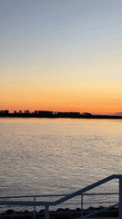 Sunset gathering at Khabarovsk waterfront with boats and city views