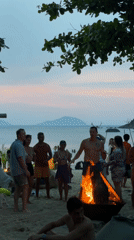 Beach bonfire gathering draws crowds at dusk in Đà Nẵng
