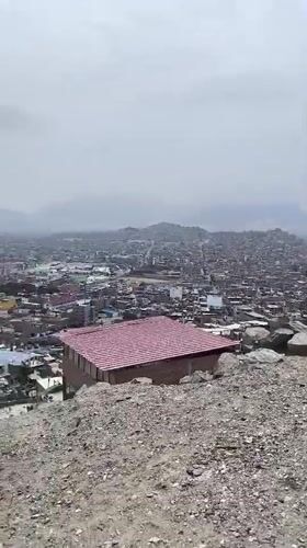 Cyclists pause at scenic overlook above Trujillo, Peru