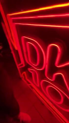 Red neon sign glowing in the dark, Izhevsk