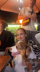 Late-night patio hangout in Krasnoyarsk with an Australian Shepherd.