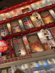 Bustling Osaka street displays vibrant nighttime commercial signage