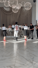 Traditional folk dancing and live drumming at a Moldovan wedding