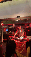 DJ performs for dancing crowd at outdoor party in Vietnam