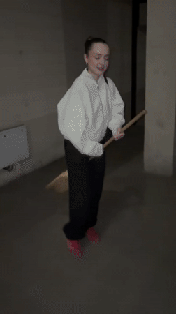 Woman attempts broom riding in Kragujevac hallway