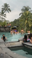 Resort guests enjoy tiered infinity pools in tropical Tegallalang
