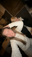 Two women celebrate with champagne and karaoke in Belgrade restaurant