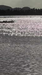 Morning surf and boat activity in General Luna