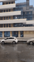 Rainy Sunday morning scenes around modern Yerevan buildings