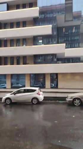 Rainy Sunday morning scenes around modern Yerevan buildings