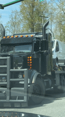 Semi-truck stops at traffic light in Burnaby